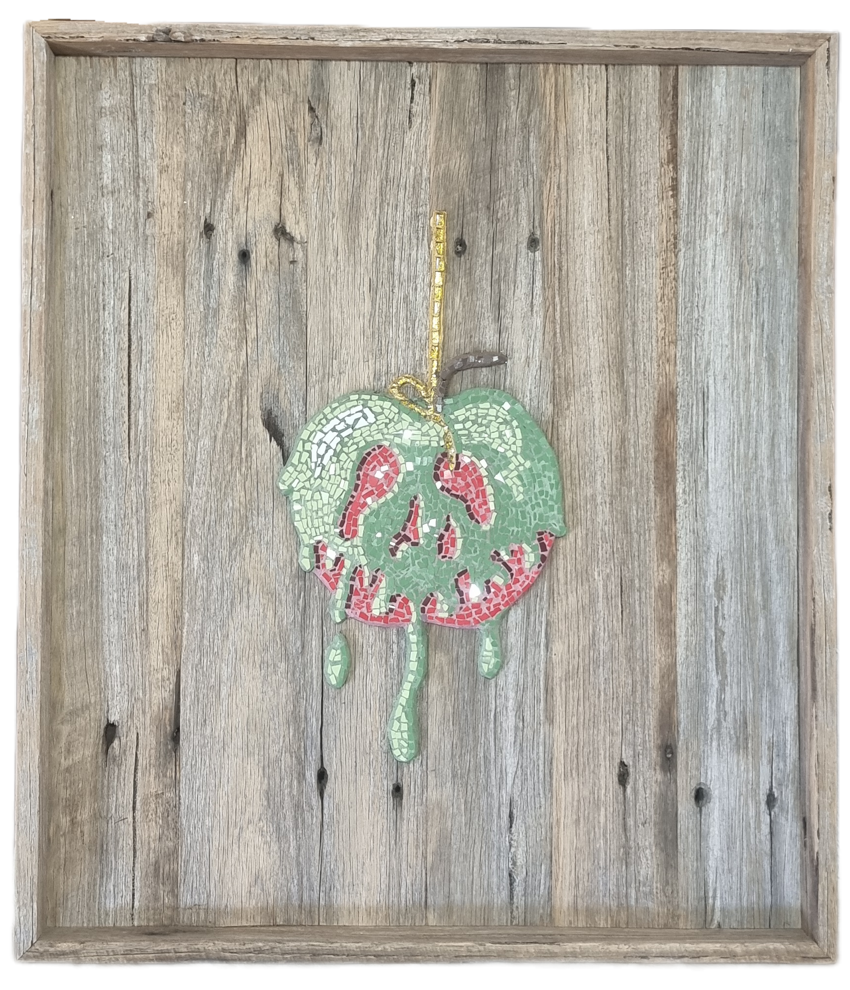 Poisoned Apple mosaic mounted in a shadow box frame, photographed with no background. The glass tiles catch the light, creating a sparkling effect that highlights the rich reds and dark accents of the design.