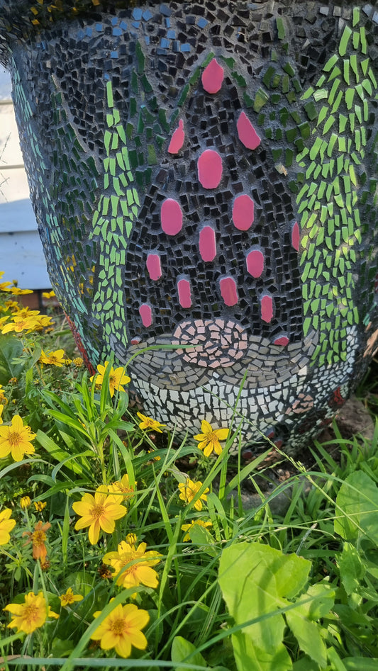 The Distinguished Gnome mosaic featured on the Christmas Gnome Pot, displayed outdoors in the garden. Handcrafted holiday artwork with rich detail, bringing festive charm and character to the landscape.