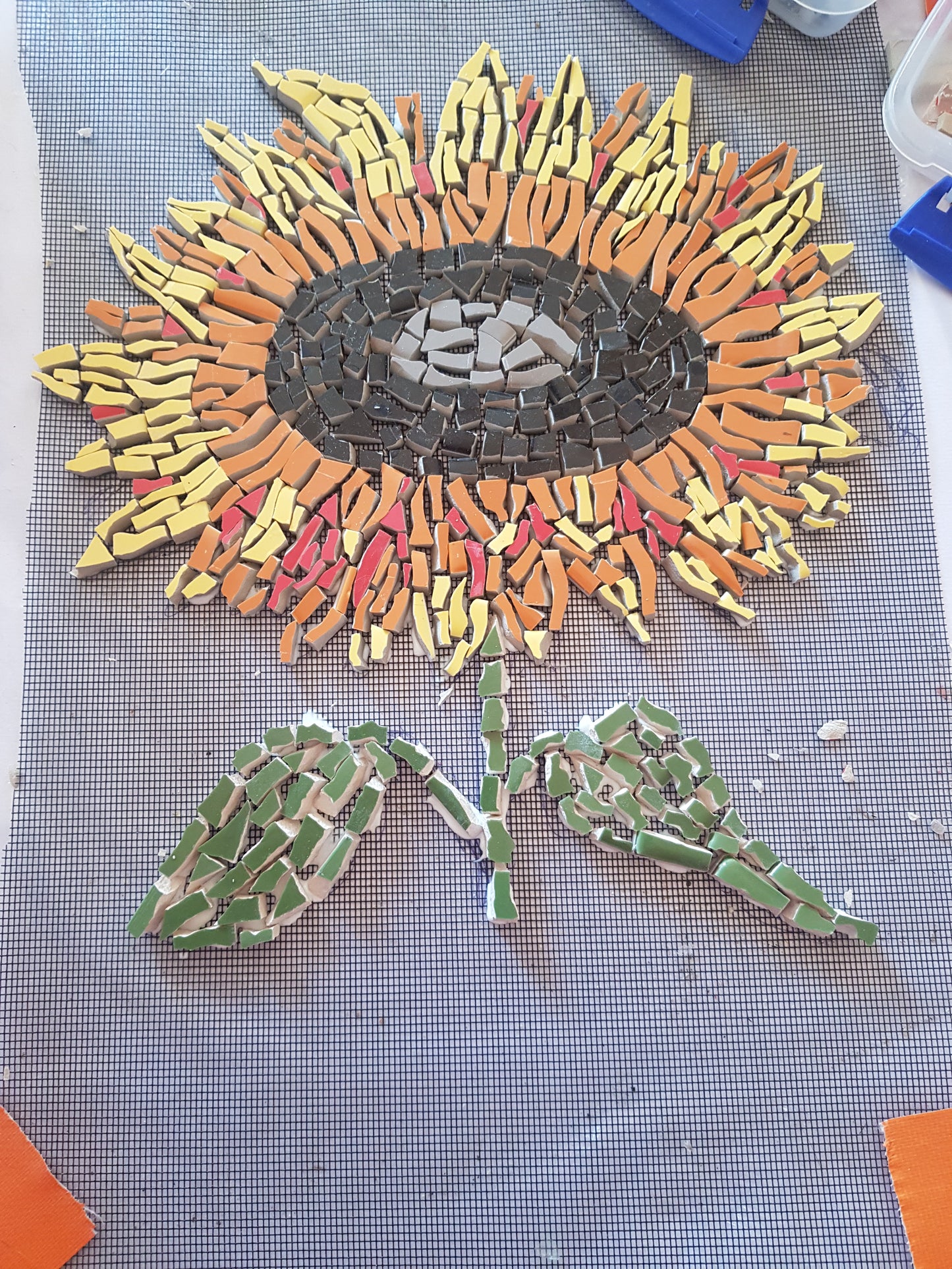 Sunflower mosaic on mesh backing, handcrafted with vibrant ceramic tiles. A bold, cheerful piece from the Cottage Garden Collection, ready for permanent installation indoors or out. Handmade mosaics for sale in Sebastopol, Victoria 