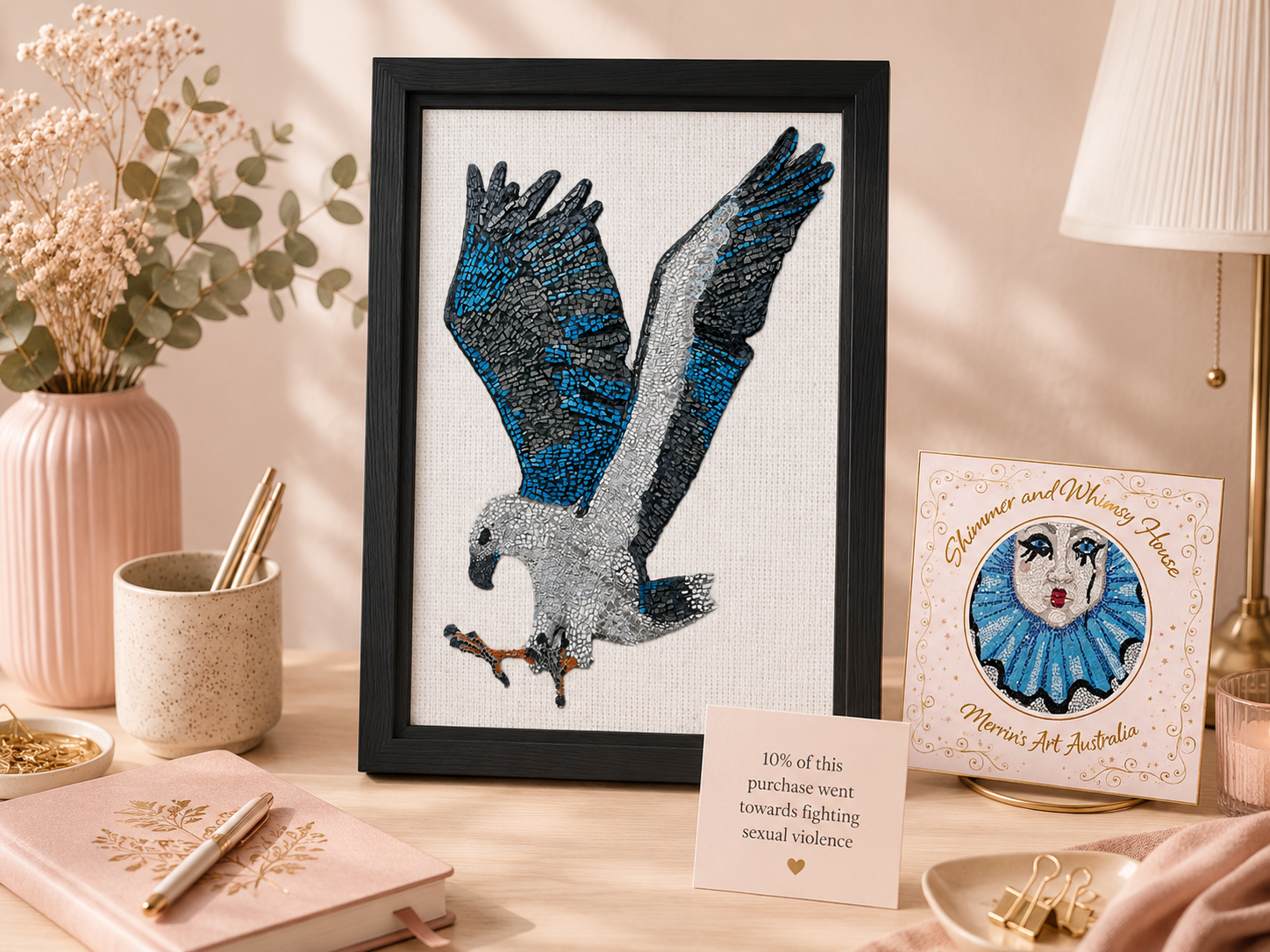 Willow the white-bellied sea eagle mosaic print on framed canvas displayed with merrins art and Shimmer and whimsy house logo with donation message m