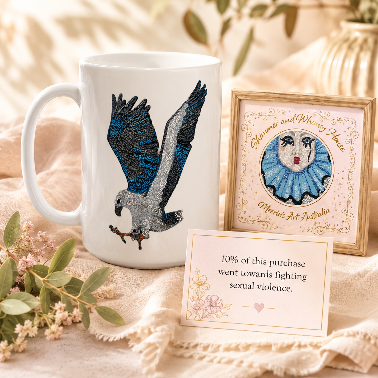 Wlllow the white-bellied sea eagle mosaic design printed on 15 oz white ceramic mug with merrins art and Shimmer and Whimsy House Logo and the 10% of each purchase is donated to fighting sexual violence message displayed