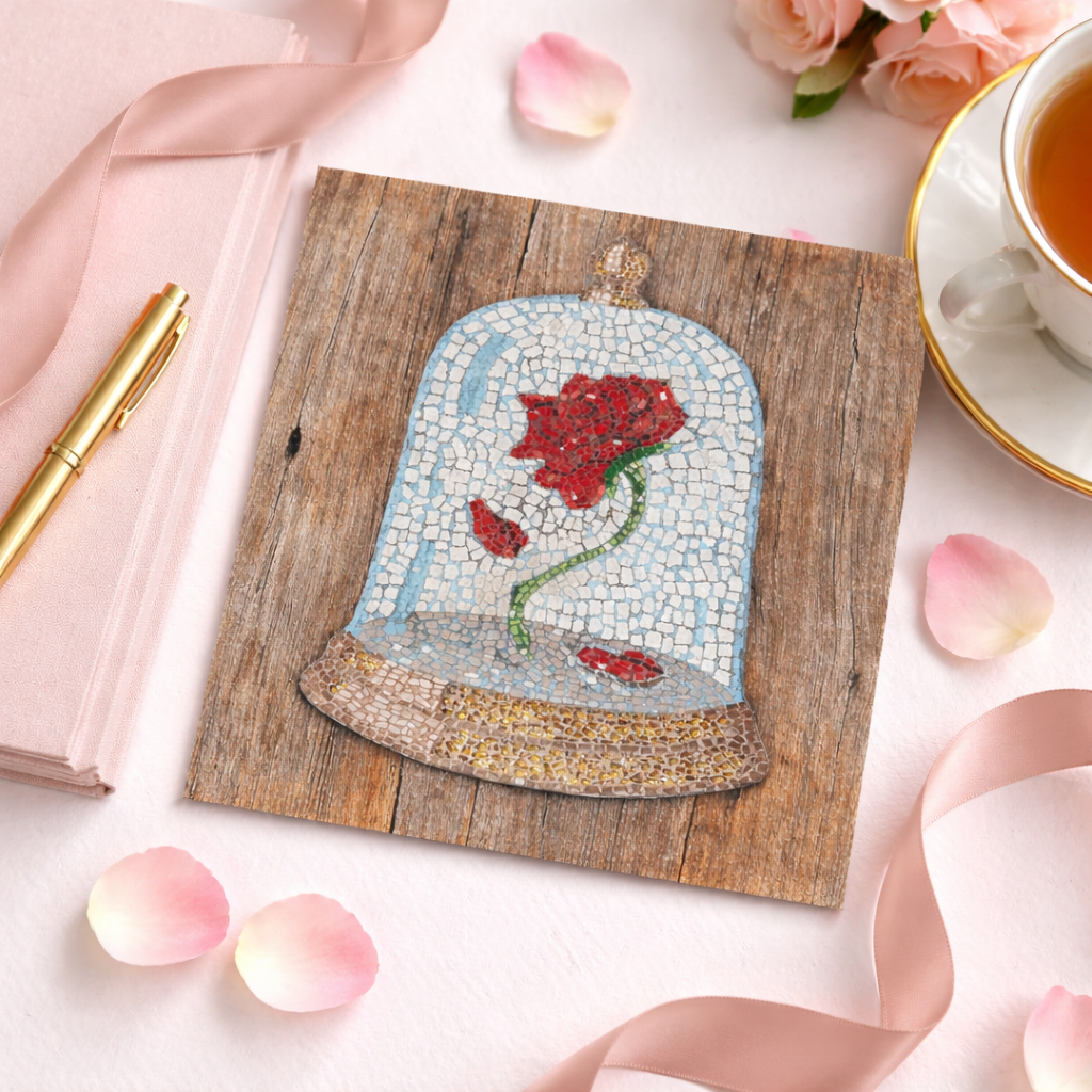 Mosaic art of a red cursed rose under a glass dome on a wooden board with tea and flowers.