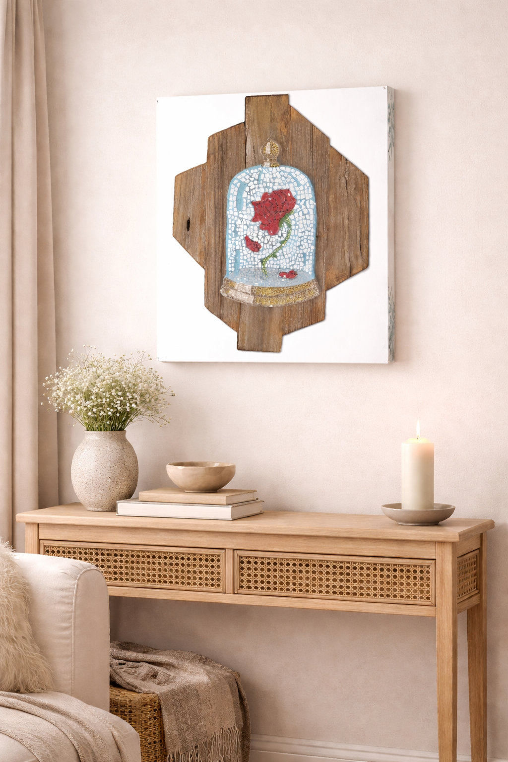 Decorative wall art of a cursed rose in a glass dome on a wooden frame, displayed above a wooden console table.