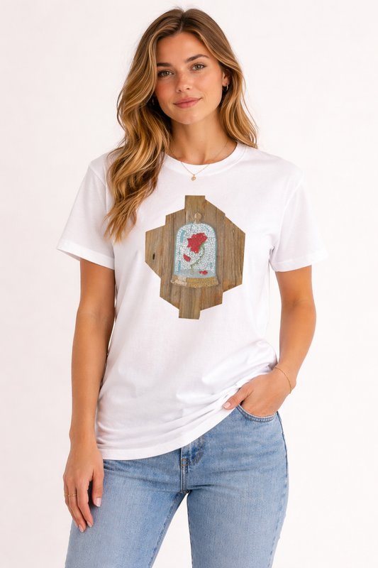 Woman wearing a white t-shirt with a cursed rose mosaic design on a plain background