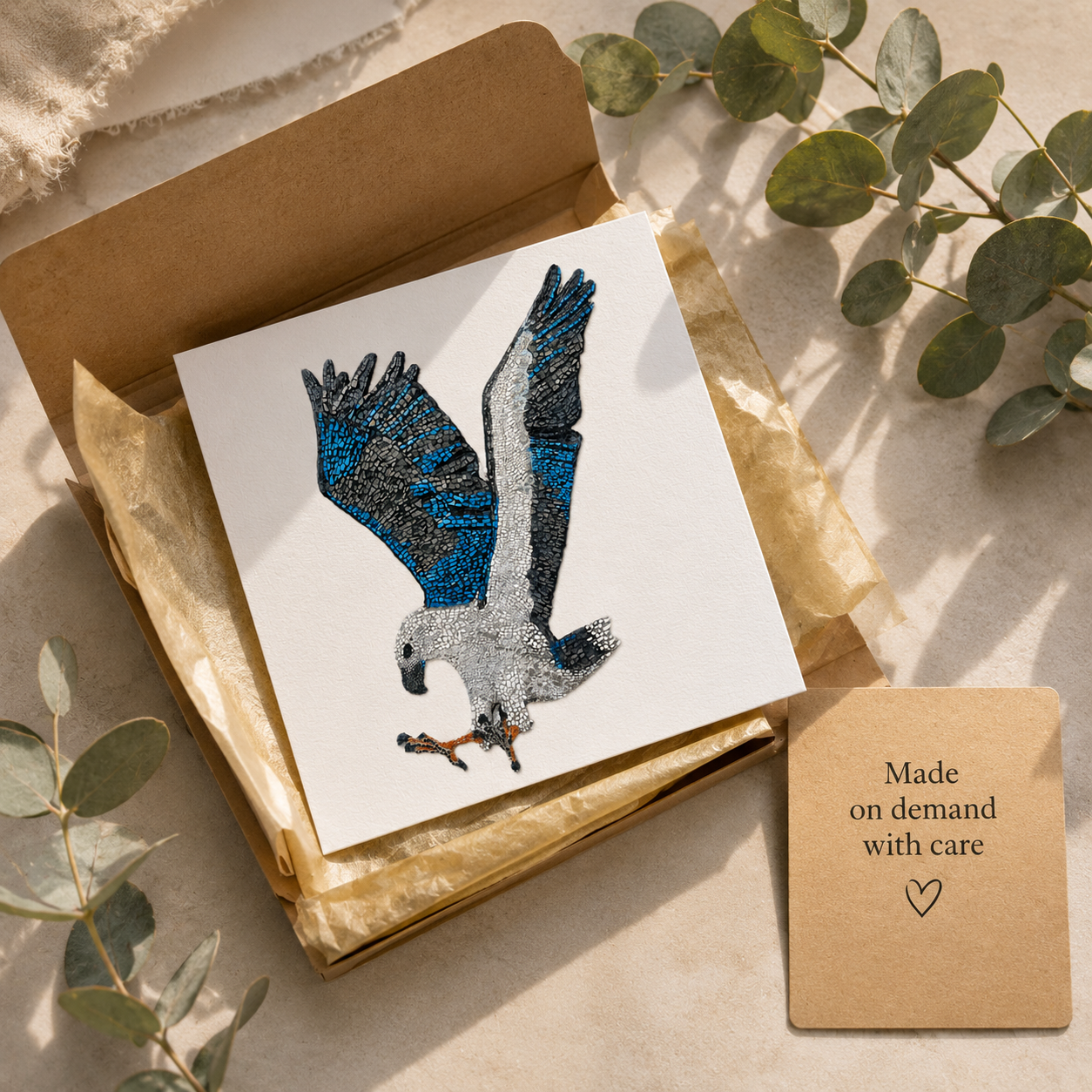 Willow White-bellied Sea Eagle postcard styled as a thoughtful gift with recycled kraft paper, soft ribbon, eucalyptus and a handwritten card reading “For the one who keeps caring,” creating a warm sustainable gift presentation for nature lovers and art collectors.