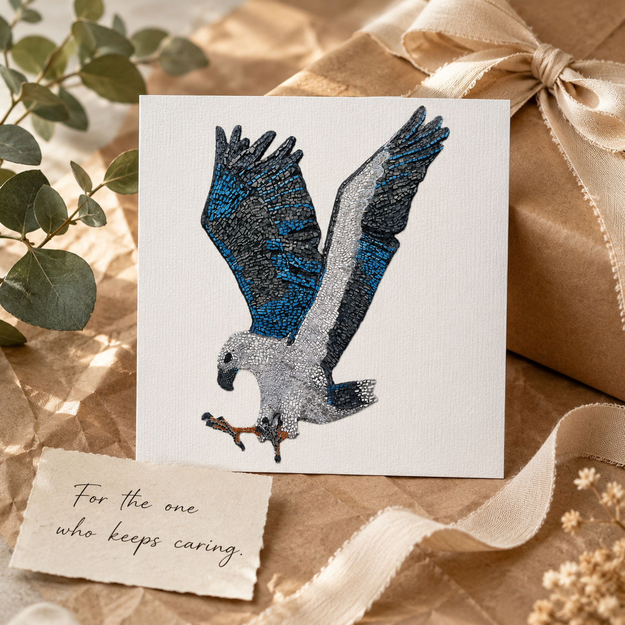 Willow White-bellied Sea Eagle postcard styled as a thoughtful gift with recycled kraft paper, soft ribbon, eucalyptus and a handwritten card reading “For the one who keeps caring,” creating a warm sustainable gift presentation for nature lovers and art collectors.