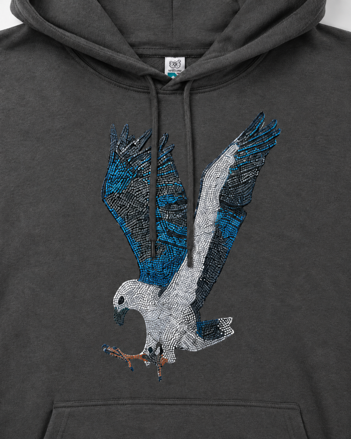 Close-up detail of the Willow White-bellied Sea Eagle mosaic artwork printed on the hoodie, showing blue feather details, white eagle body, mosaic texture, fabric surface, and print clarity.