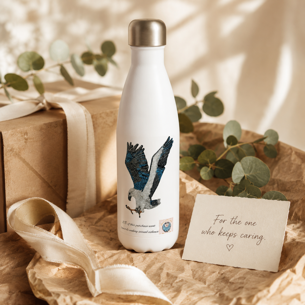 Willow White-bellied Sea Eagle stainless steel water bottle styled as a thoughtful art gift with recycled paper, soft ribbon, eucalyptus and a caring handwritten note.