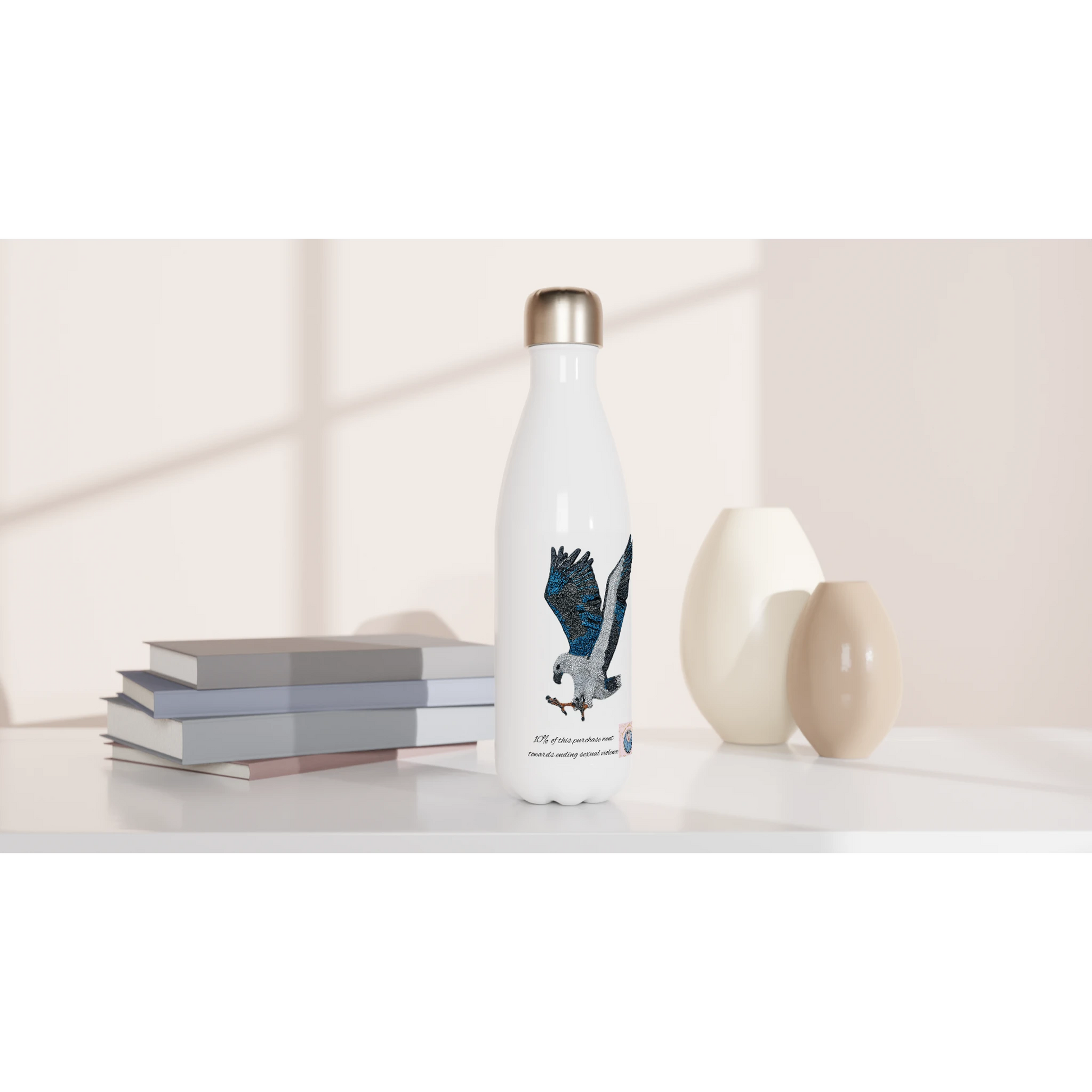Willow White-bellied Sea Eagle stainless steel water bottle styled on shelf with books and vases